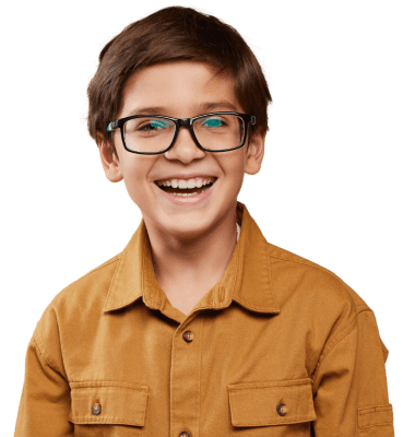 young child smiling wearing glasses