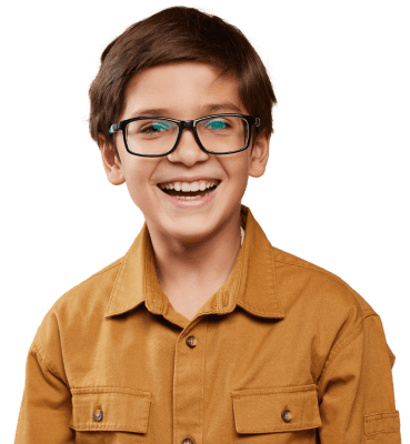 young child smiling wearing glasses